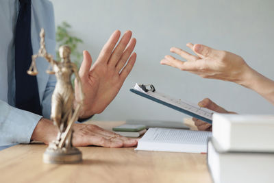 Cropped hands of man gesturing while discussing