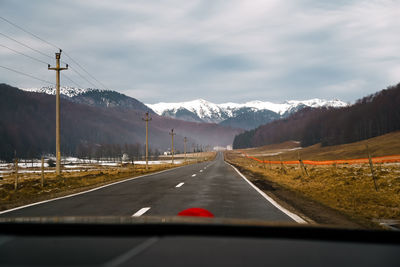 Road seen through car windshield