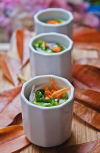 Close-up of salad in bowls on table