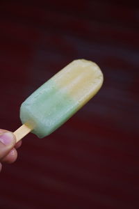 Hand holding ice cream