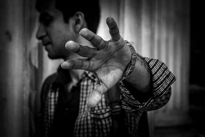 Close-up of man hand with tattoo