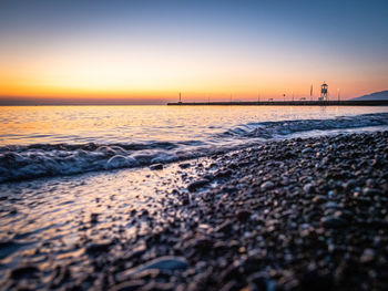 Scenic view of sea against clear sky during sunset