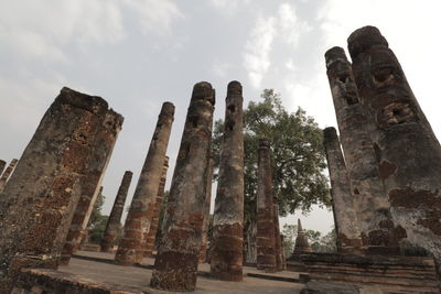 Low angle view of old ruins against sky