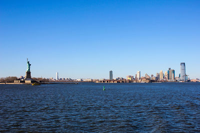 View of buildings against blue sky