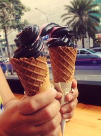 Close-up of hand holding ice cream