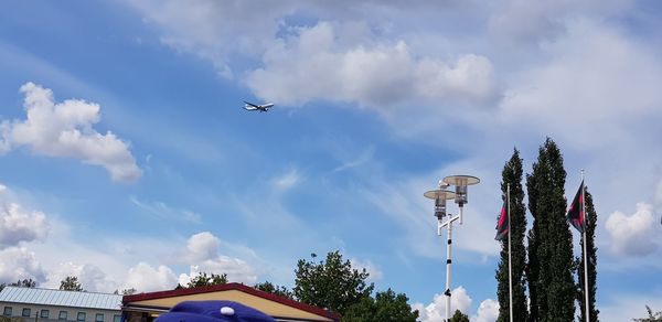 Low angle view of airplane flying in sky