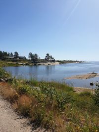 Scenic view of beach against clear sky