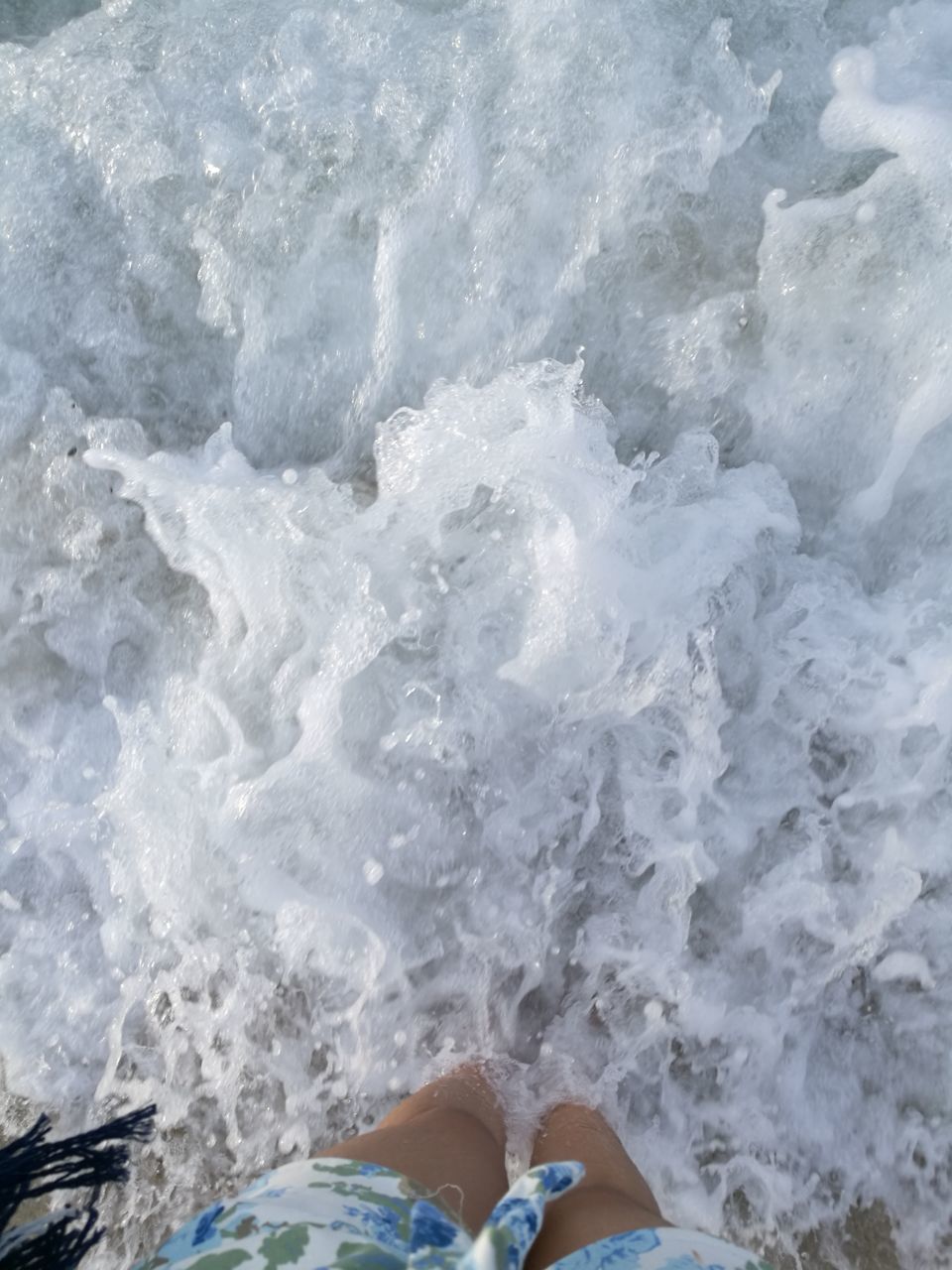 water, sea, nature, motion, day, one person, wave, beauty in nature, outdoors, real people, human leg, low section, human body part, close-up, people