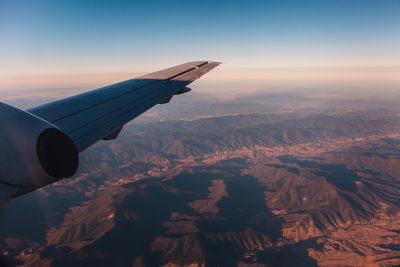 Aerial view of landscape against sky during sunset