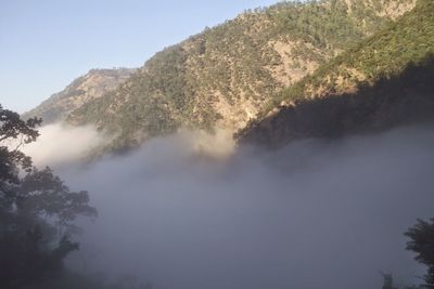Scenic view of tree mountains against sky