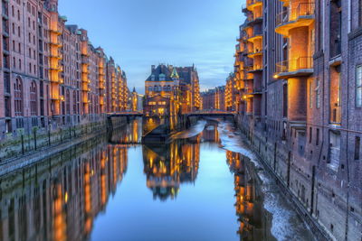 Night view of illuminating speicherstadt warehouses along the canal, hamburg, germany - hdr