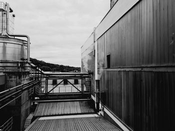 Pier amidst buildings against sky