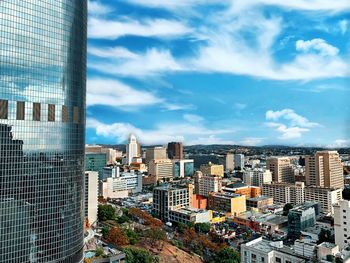 Buildings in city against sky