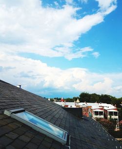 High angle view of buildings in town against sky