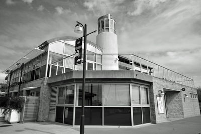 Low angle view of building against cloudy sky