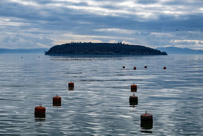 Scenic view of bay in sea against sky