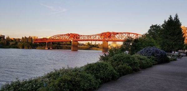 Bridge over river against sky