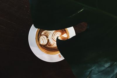 High angle view of coffee cup on table