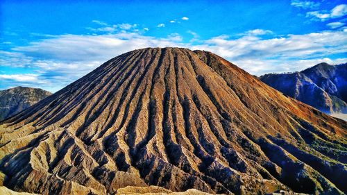 Panoramic view of volcanic mountain range against sky