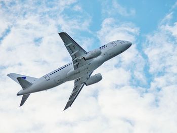 Low angle view of airplane against sky