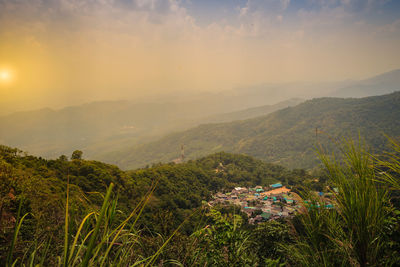 Scenic view of landscape and mountains against sky