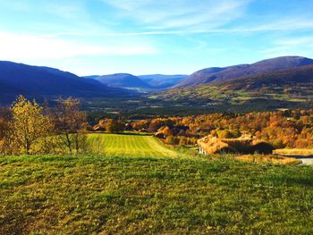 Countryside landscape against mountain range