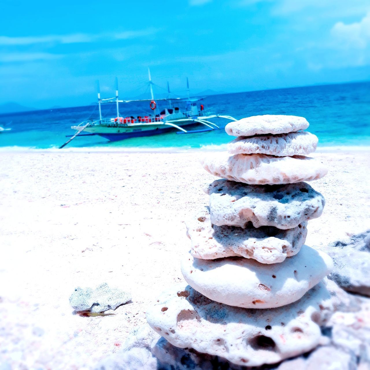 STACK OF BOATS MOORED ON SHORE