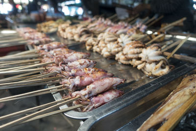 Close-up of squids on barbecue grill