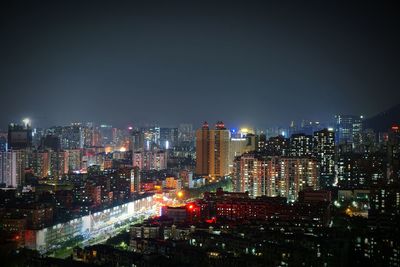 Illuminated cityscape at night