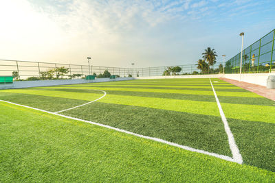 Scenic view of soccer field against sky