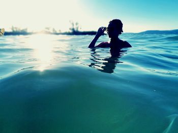 Portrait of boy swimming in sea