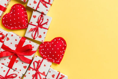 Directly above shot of christmas decorations on red background