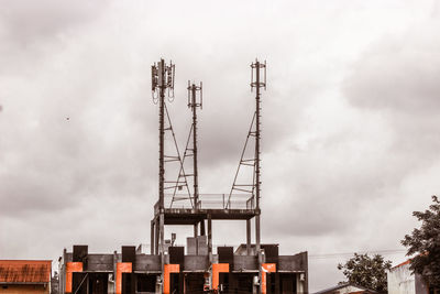 Low angle view of crane against sky