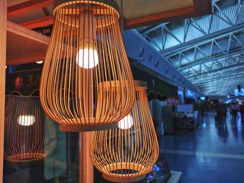 Low angle view of illuminated lights hanging from ceiling