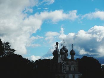 Low angle view of building against cloudy sky