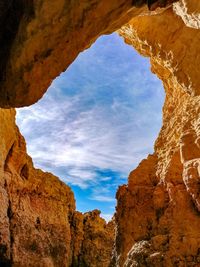 Low angle view of rock formations against blue sky