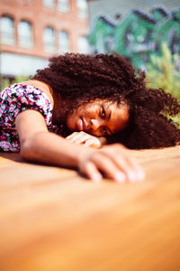 Portrait of young woman lying down