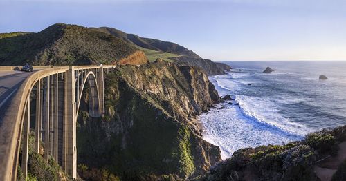 Bixby creek bridge by sea against sky