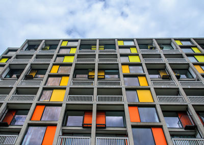 Low angle view of yellow building against sky