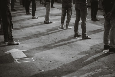 Low section of people walking on footpath