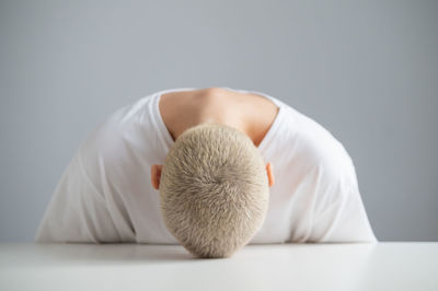 Close-up of woman sleeping on table