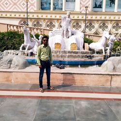 Full length of man standing by fountain