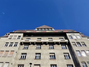Low angle view of building against blue sky