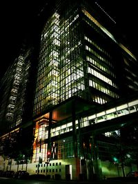 Low angle view of illuminated building at night