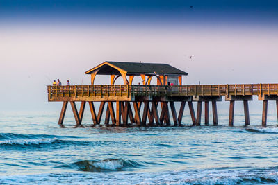 Pier on sea against sky