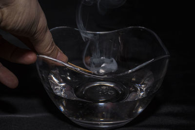 Close-up of glass over white background