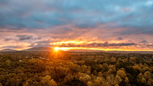 Scenic view of landscape against sky during sunset