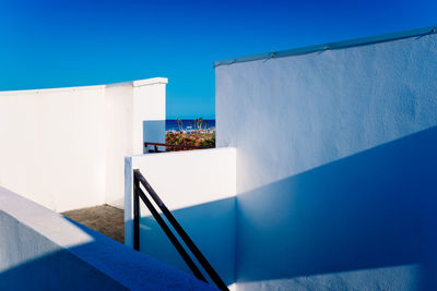 Low angle view of building against clear blue sky