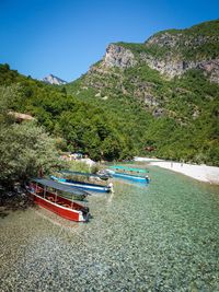 Scenic view of sea and mountains against sky