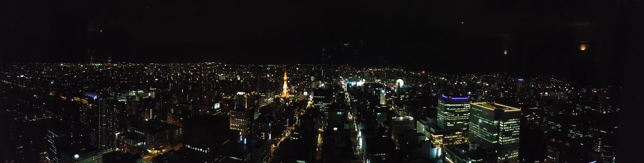 ILLUMINATED CITYSCAPE AT NIGHT